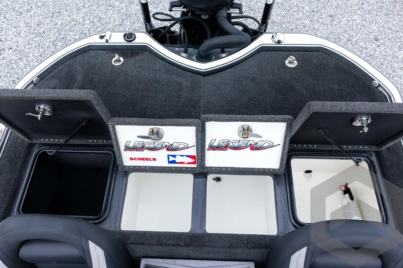 Slide: The Image of 2015 Legend V-20 boat storage compartments with open lids, showcasing interior space. - 30