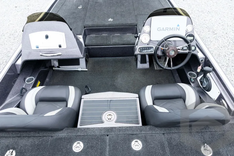 Slide: The Image of 2015 Legend V-20 boat interior with Garmin navigation, dual seats, and steering wheel. - 25