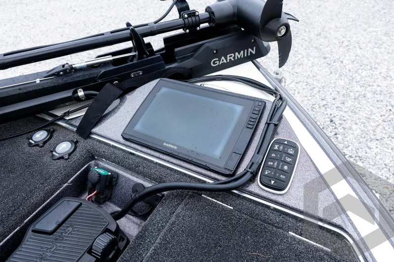 Slide: The Image of Control panel of a 2015 Legend V-20 boat featuring Garmin electronics. - 21