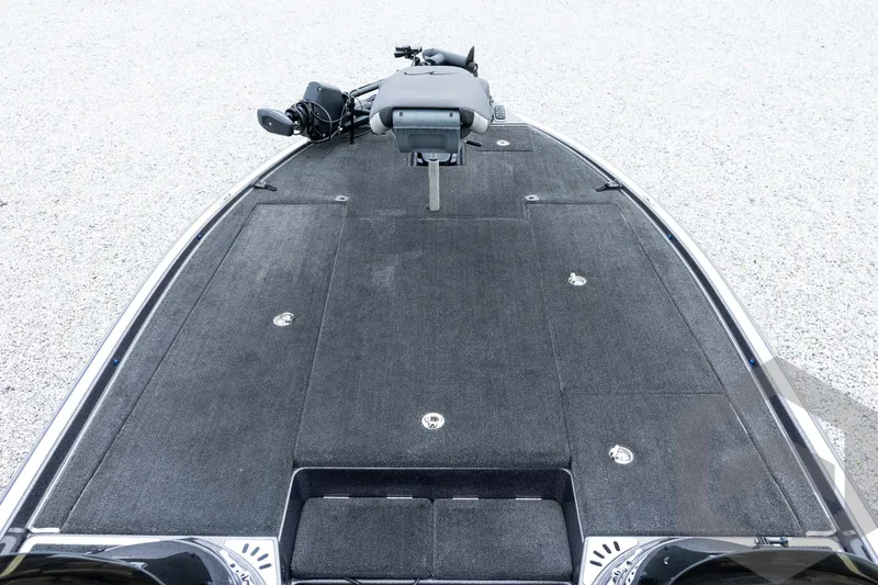 Slide: The Image of 2015 Legend V-20 boat deck with trolling motor, featuring spacious carpeted surface. - 18