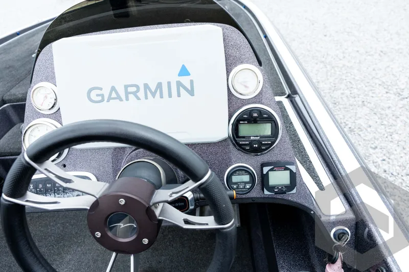Slide: The Image of Steering console of 2015 Legend V-20 boat with Garmin navigation system. - 27