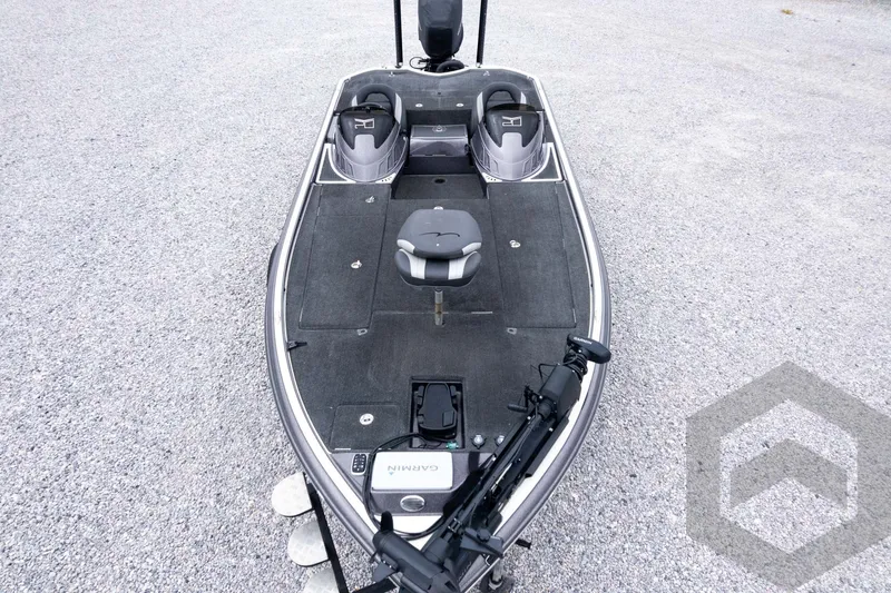 Slide: The Image of 2015 Legend V-20 boat with dual seats and Garmin equipment on gravel surface. - 46