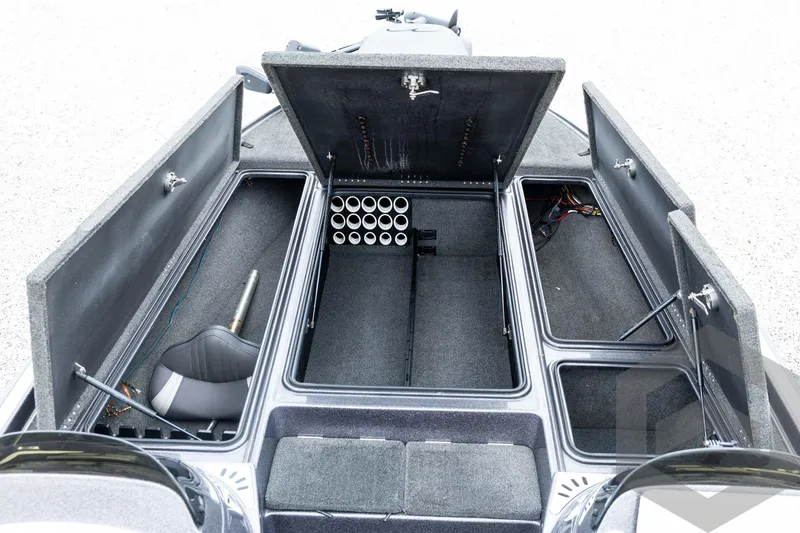 Slide: The Image of Open storage compartments of a 2015 Legend V-20 boat, showcasing organized interior space. - 22