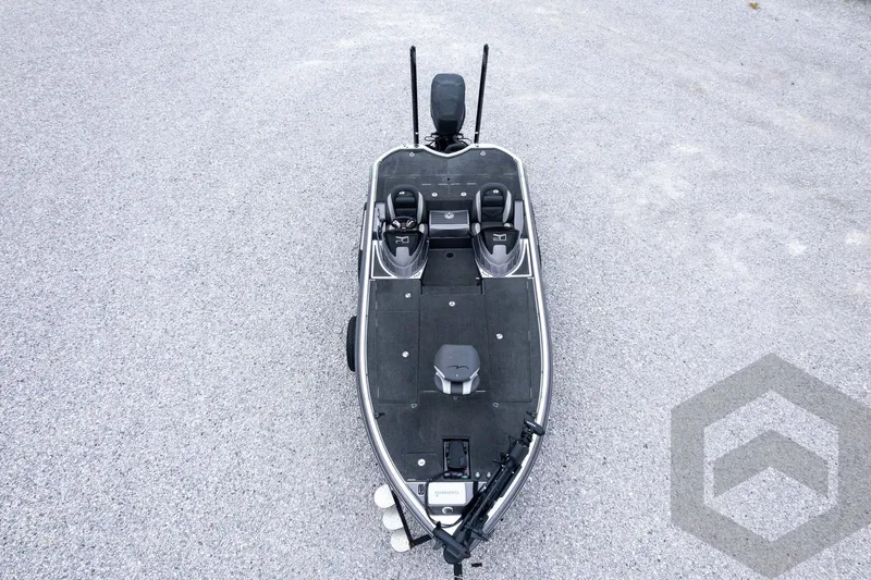 Slide: The Image of 2015 Legend V-20 boat on gravel, top view, showcasing seating and deck layout. - 41
