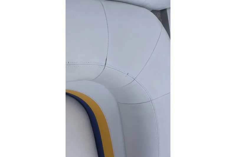 Slide: The Image of Close-up of 2007 Manitou 22 Oasis boat upholstery with blue and yellow accents. - 38