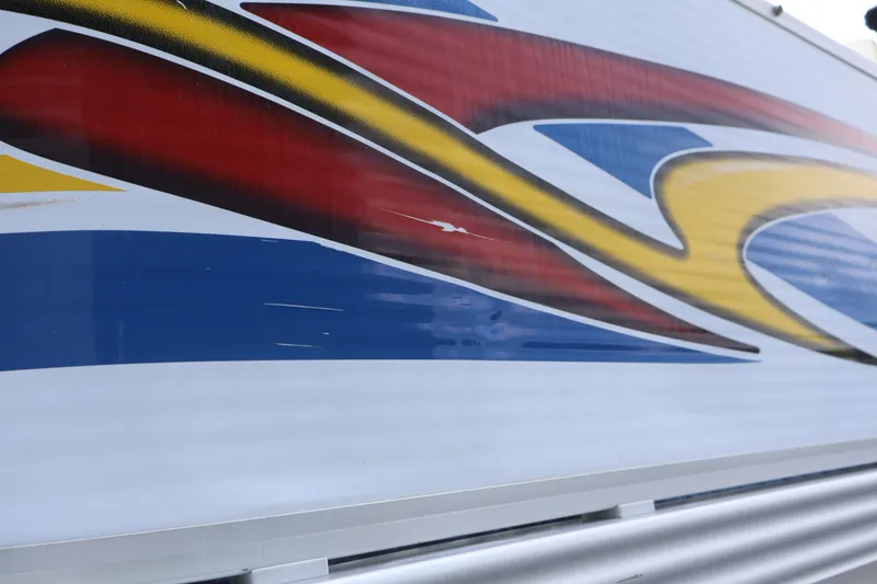 Slide: The Image of Colorful abstract design on 2007 Manitou 22 Oasis boat exterior. - 18