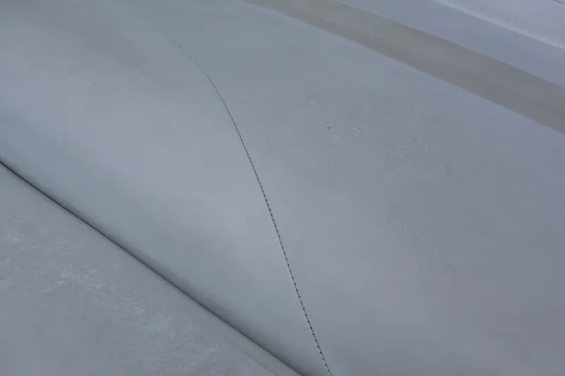 Slide: The Image of Close-up of 2007 Manitou 22 Oasis boat upholstery, showing stitching detail. - 31