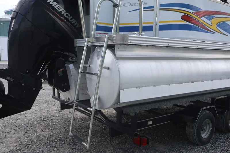 Slide: The Image of 2007 Manitou 22 Oasis pontoon boat with Mercury outboard motor and trailer. - 19