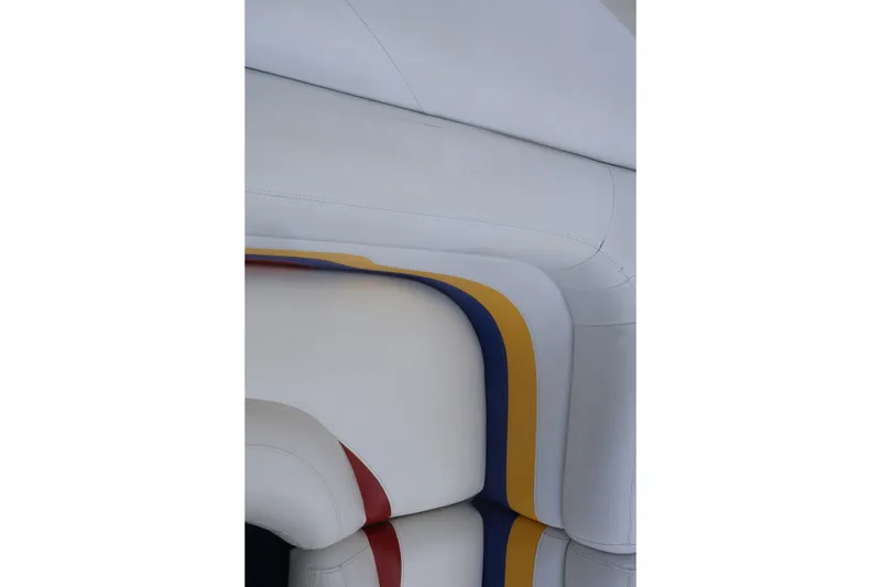 Slide: The Image of Interior seating of 2007 Manitou 22 Oasis boat with colorful striped design. - 37