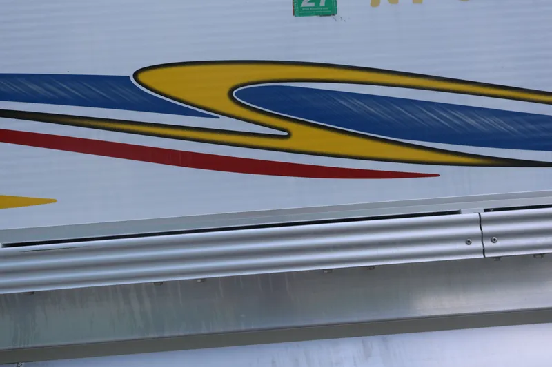Slide: The Image of Colorful abstract design on 2007 Manitou 22 Oasis boat exterior. - 16