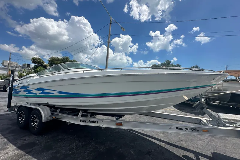 Slide: The Image of 2000 Formula 271 FASTech boat on trailer under blue sky with clouds. - 6