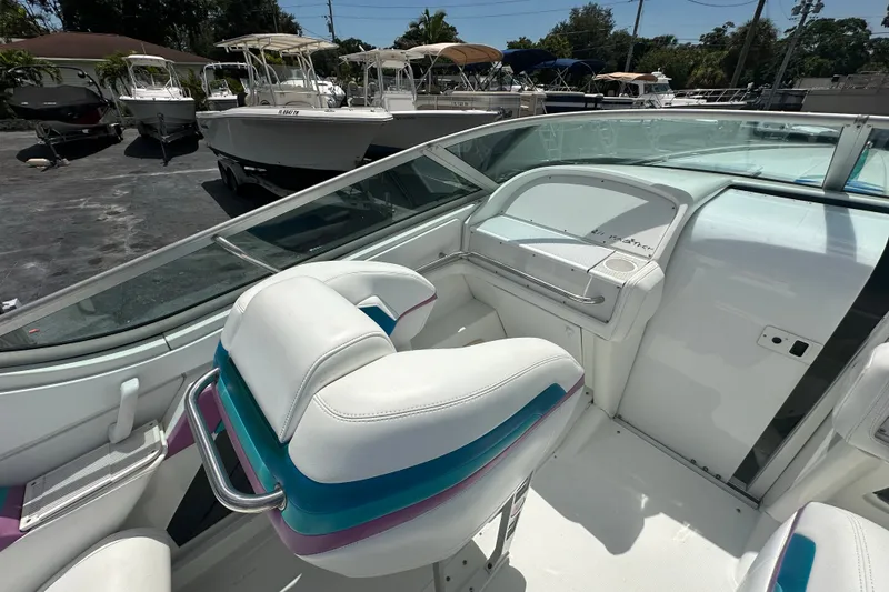 Slide: The Image of Interior of a 2000 Formula 271 FASTech boat with white and teal seating. - 13