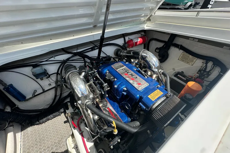 Slide: The Image of Engine compartment of a 2000 Formula 271 FASTech boat, featuring a powerful Mercury engine. - 16