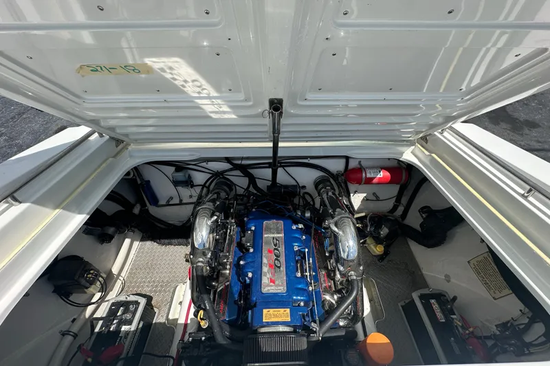 Slide: The Image of Engine compartment of a 2000 Formula 271 FASTech boat, featuring a powerful engine setup. - 18