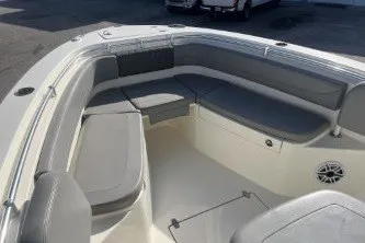 Slide: The Image of 2024 Cobia 262 Center Console boat with spacious seating and modern design. - 10