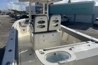 Slide: The Image of 2024 Cobia 262 Center Console boat with spacious deck and dual seating. - 7