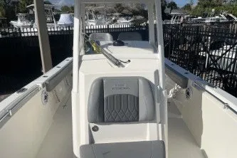 Slide: The Image of 2024 Cobia 262 Center Console boat with sleek design and spacious seating. - 11