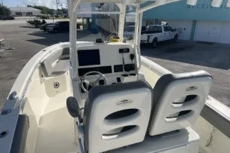 Slide: The Image of 2024 Cobia 262 Center Console boat interior with dual seats and modern dashboard. - 8