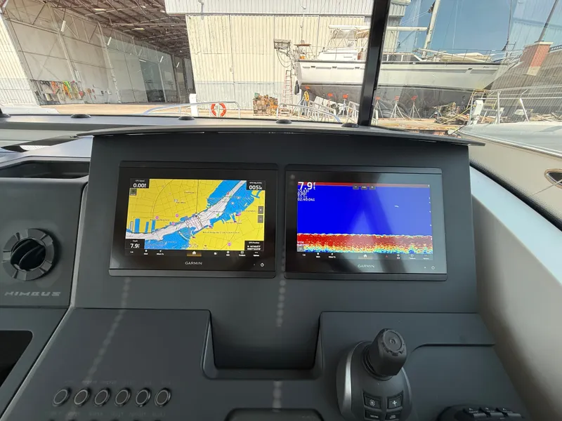 Slide: The Image of The image shows the dashboard of a 2024 Nimbus Commuter 11 with two Garmin screens. - 20