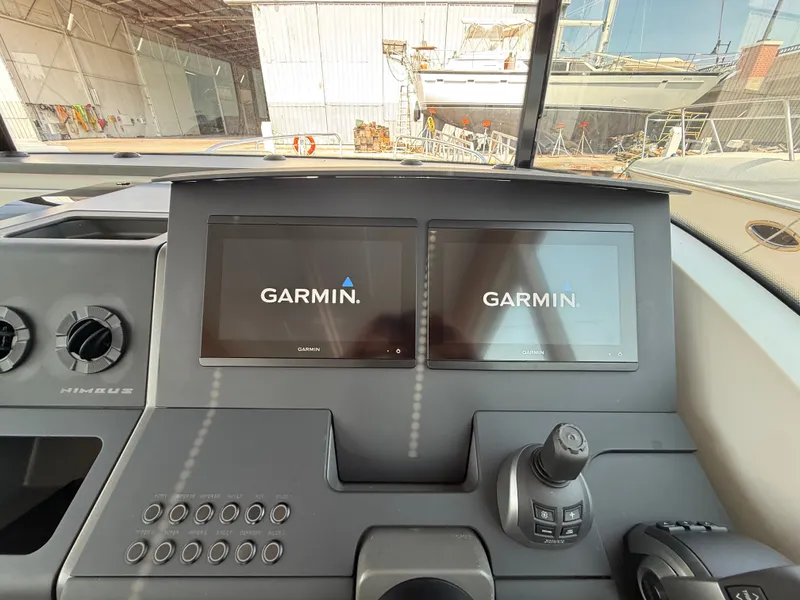 Slide: The Image of The dashboard of a 2024 Nimbus Commuter 11 with two Garmin screens. - 17