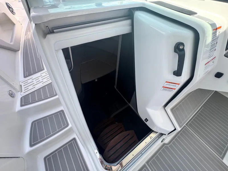 Slide: The Image of Entrance to the cabin of the Sea Ray Sundancer 320 Outboard with gray flooring. - 11