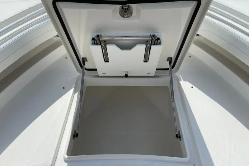 Slide: The Image of Open storage compartment on a 2022 Regulator 34 boat, showcasing interior space. - 52