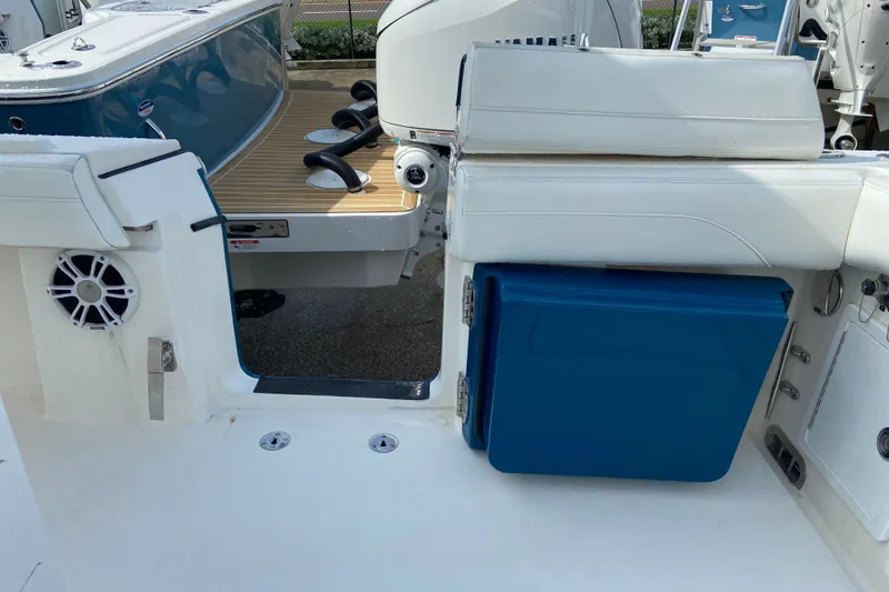 Slide: The Image of 2022 Regulator 34 boat interior with seating and storage compartment. - 25