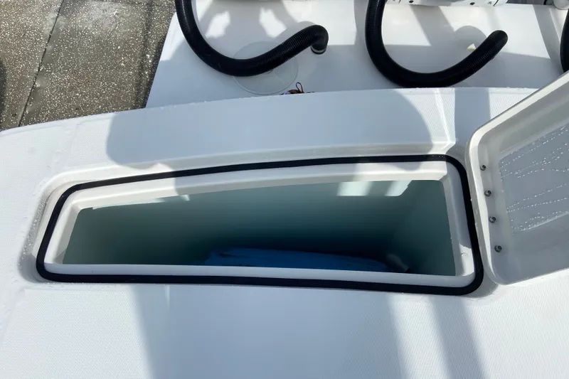 Slide: The Image of Open storage compartment on 2022 Regulator 34 boat, showcasing interior space. - 18