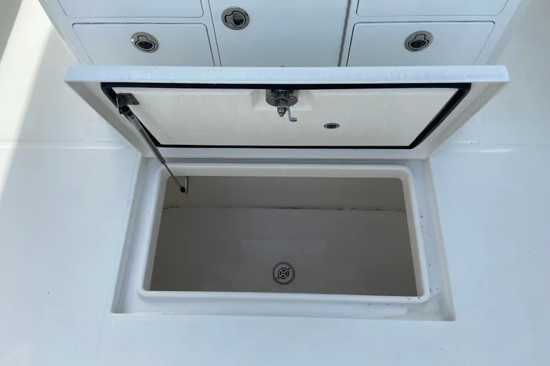 Slide: The Image of Open storage compartment on a 2022 Regulator 34 boat, showcasing interior space. - 28