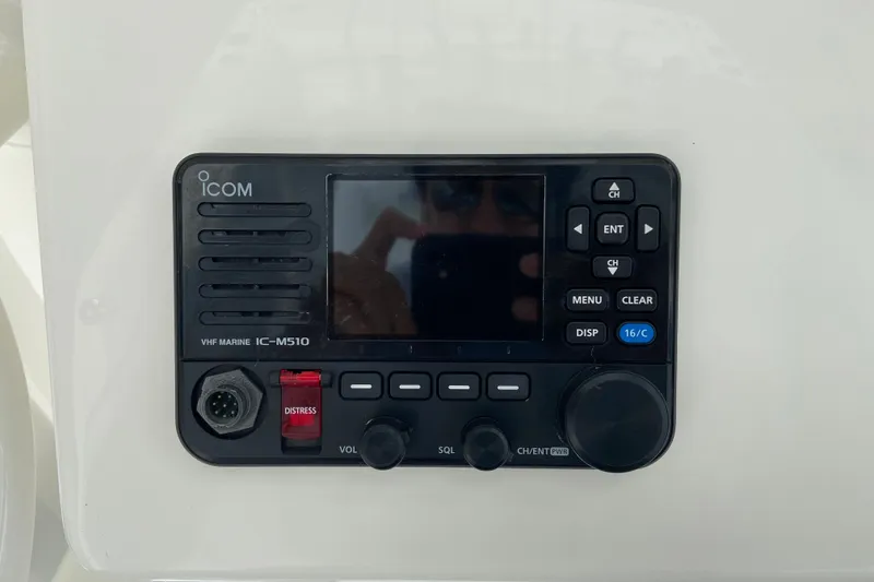 Slide: The Image of ICOM VHF Marine IC-M510 radio on 2022 Regulator 34 boat dashboard. - 44