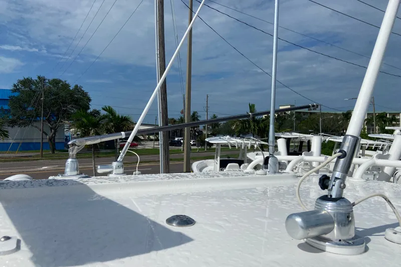Slide: The Image of 2022 Regulator 34 boat deck with antennas and clear sky background. - 34