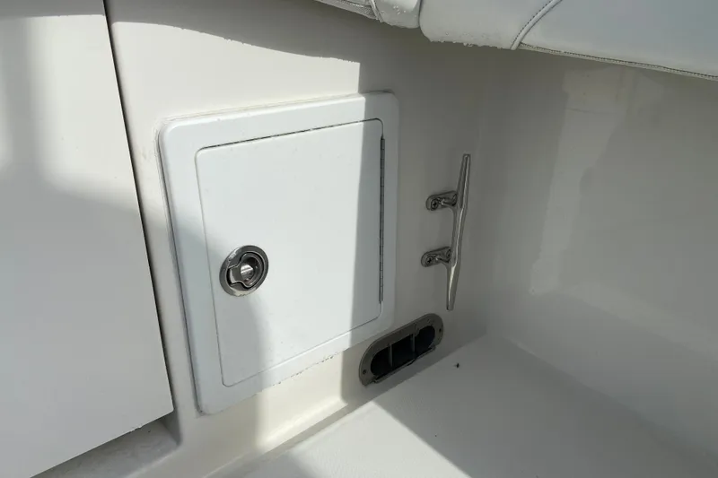Slide: The Image of 2022 Regulator 34 boat compartment with lock and cleat detail. - 22