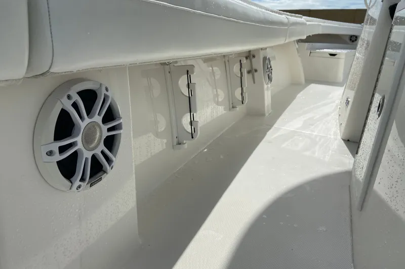 Slide: The Image of 2022 Regulator 34 boat interior with speakers and seating, showcasing sleek design. - 47
