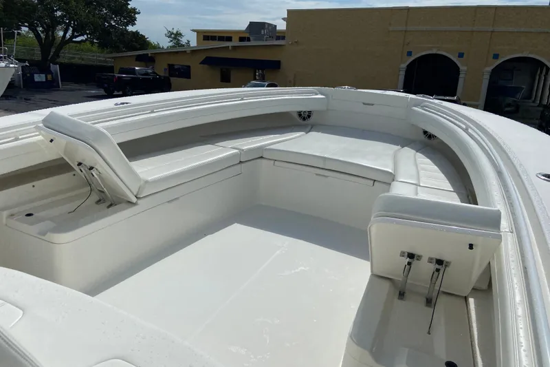 Slide: The Image of 2022 Regulator 34 boat with spacious white seating area and modern design. - 56
