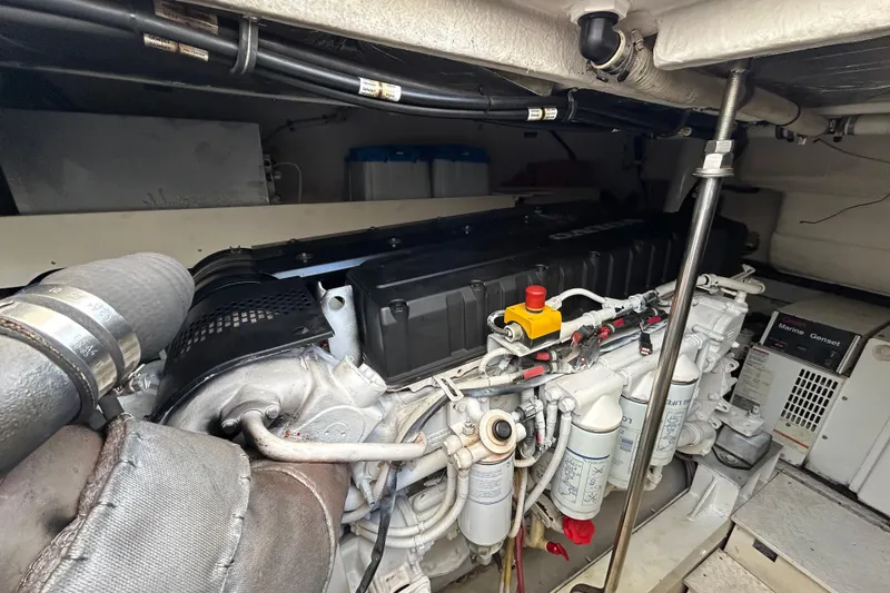 Slide: The Image of Engine room of 2006 Cruisers Yachts 520 Express, showcasing marine engine components. - 40