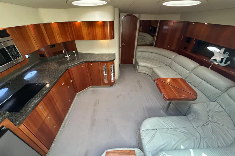 Slide: The Image of Luxurious 2006 Cruisers Yachts 520 Express interior with modern kitchen and plush seating. - 23