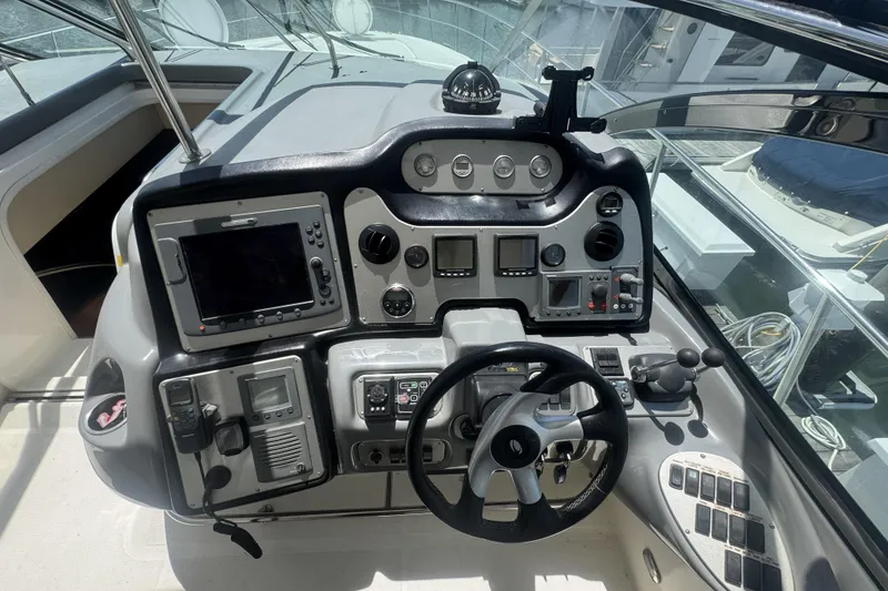 Slide: The Image of Cockpit of 2006 Cruisers Yachts 520 Express with navigation instruments and steering wheel. - 22
