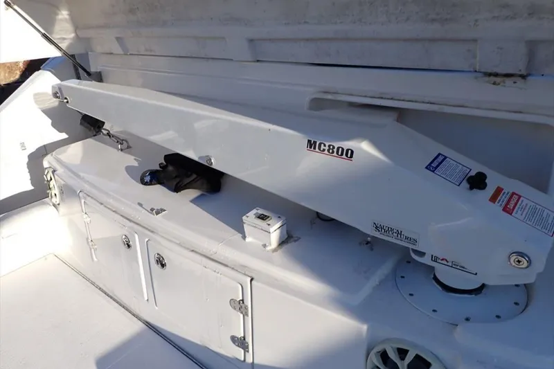 Slide: The Image of 2006 Cruisers Yachts 520 Express deck with MC800 equipment and storage compartments. - 13