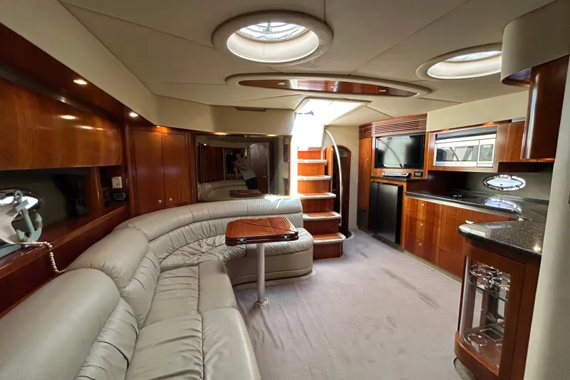 Slide: The Image of Luxurious interior of 2006 Cruisers Yachts 520 Express with elegant wood finishes and modern amenities. - 26