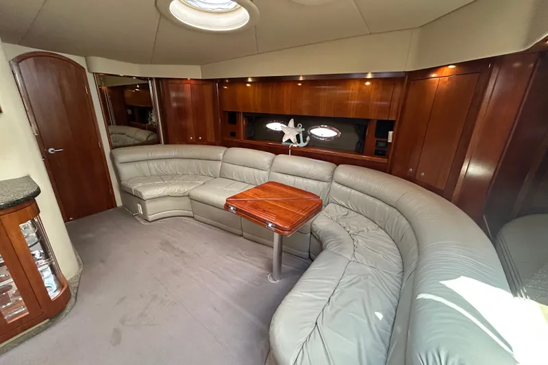 Slide: The Image of Luxurious 2006 Cruisers Yachts 520 Express interior with plush seating and elegant wood finishes. - 27
