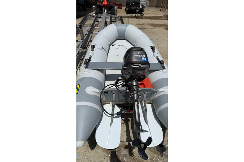 Slide: The Image of 2004 Zodiac Cadet Fastroller 310 FR Acti-V inflatable boat with Nissan outboard motor. - 9
