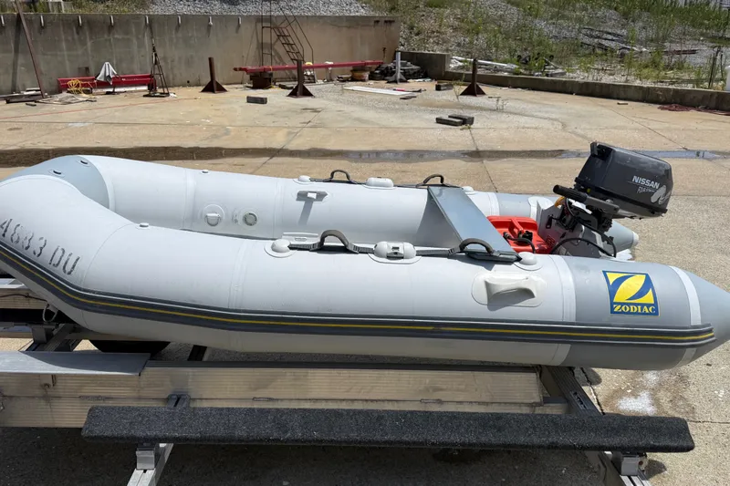 Slide: The Image of 2004 Zodiac Cadet Fastroller 310 FR Acti-V inflatable boat with Nissan outboard motor. - 11