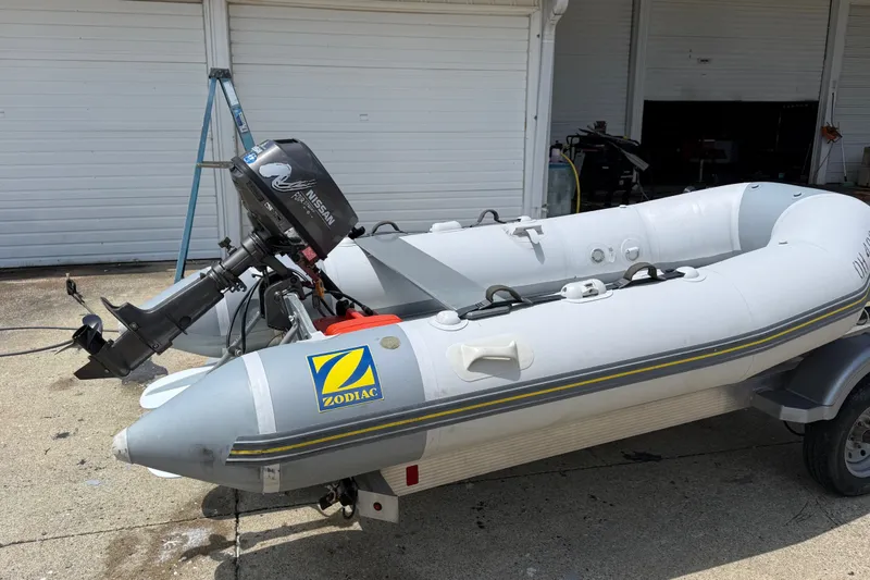Slide: The Image of 2004 Zodiac Cadet Fastroller 310 FR Acti-V inflatable boat with Nissan outboard motor. - 10