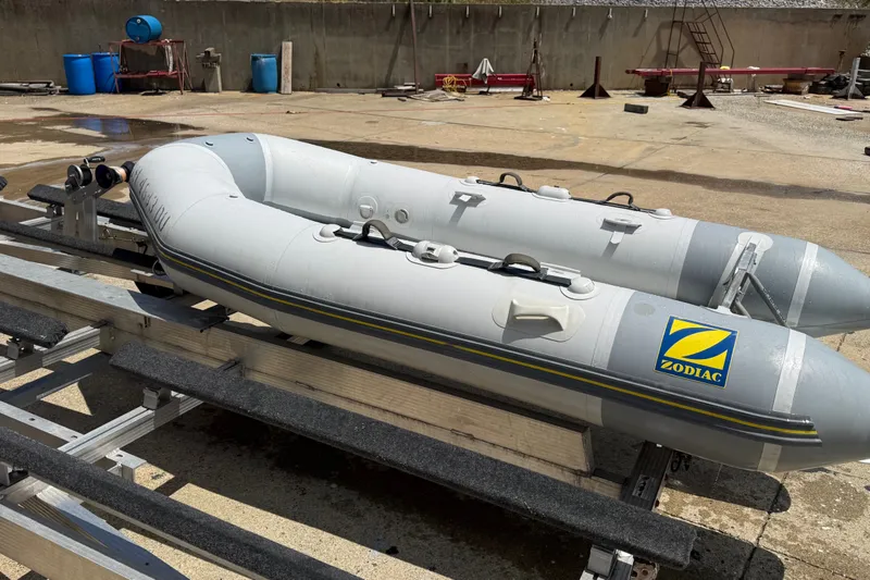 Slide: The Image of 2004 Zodiac Cadet Fastroller 310 FR Acti-V inflatable boat on a trailer. - 17