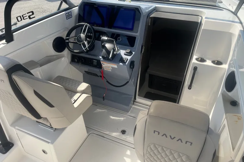 Slide: The Image of Interior of 2025 Navan S30 boat with modern helm and seating. - 14