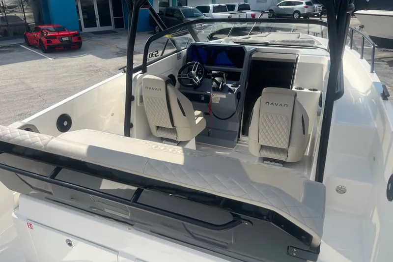 Slide: The Image of Interior view of 2025 Navan S30 boat with modern seating and dashboard. - 16