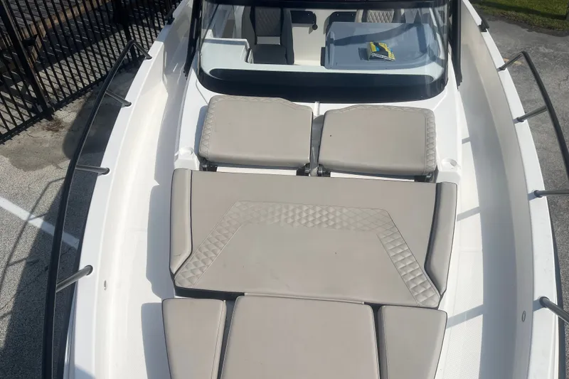 Slide: The Image of 2025 Navan S30 boat with cushioned seating and sleek design. - 15