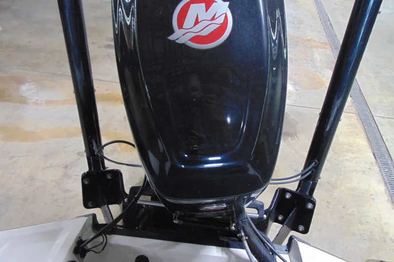 Slide: The Image of 2018 Ranger Z185 boat engine with Mercury logo in a garage setting. - 14