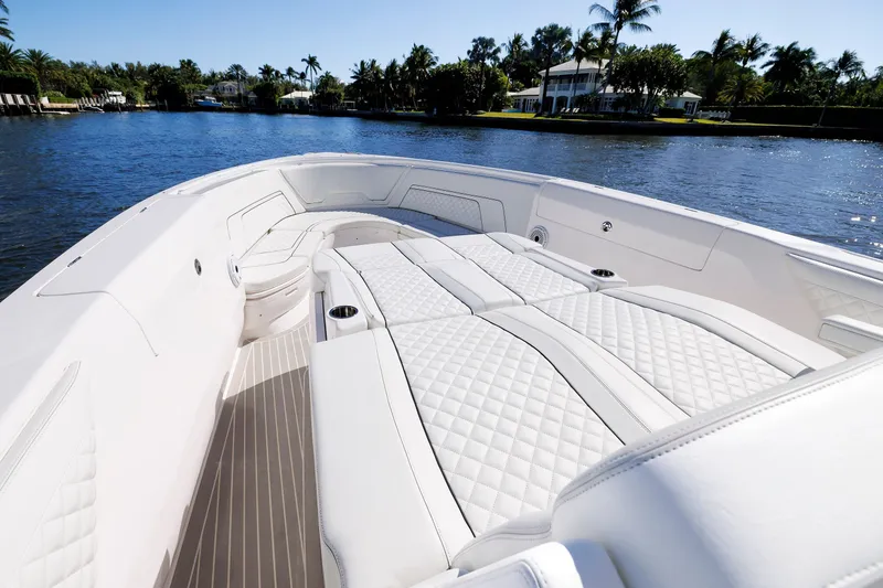 Slide: The Image of Luxurious 2021 Intrepid 407 Nomad SE boat interior with white quilted seating on a sunny day. - 11