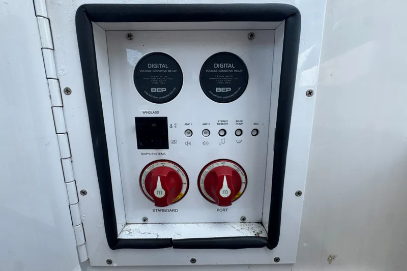 Slide: The Image of Control panel of a 2017 Four Winns H290 boat with digital voltage relays. - 17